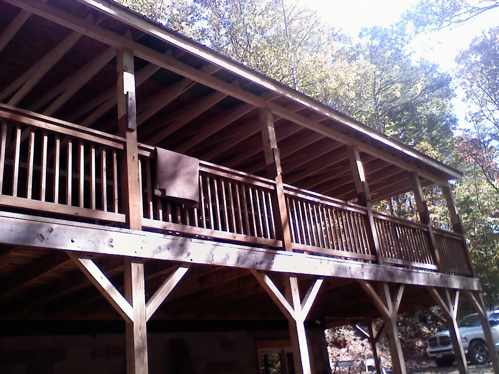 Timber framing under a new elevated porch and deck — Roof Leak Repair in West Eaton by Roofing Brothers